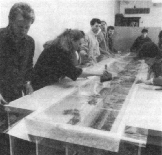 Library staff working on the conservation of Samuel Jackson’s Panorama of early Melbourne. [photograph]