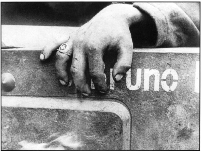 ‘the blood flesh and steel of nazidom stopped cold’. Published in the Australasian in 1944. Shows the hand of an anonymous young, dead German soldier. [H98.101/1332, International News Photo] [photograph]