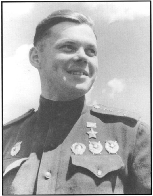 Guards Captain Grigory Rechkalov, a Hero of the Soviet Union, with three orders on this tunic. Gelatin Silver toned photograph by S. Kafafayon. [H98. 101/1227, text by N. Virta, published Australasian, 9 December 1944] [photograph]