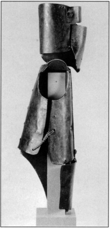 Adrian Flint, 1960 -, photographer. Set of six views of Ned Kelly's armour taken in the Conservation Section of the State Library of Victoria. Photograph shows profile view. Gelatin silver photograph. [photograph]