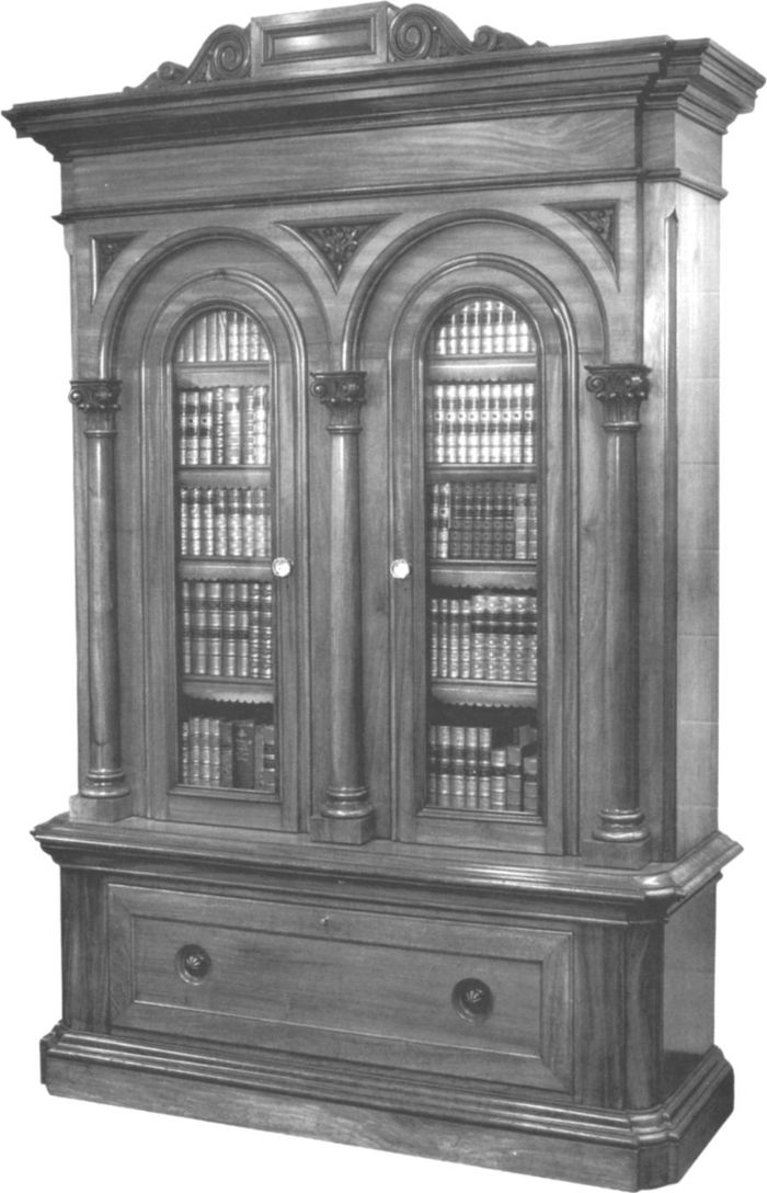 Australian cedar bookcase, one of a pair, made by James McEwan, Cabinet and Chair Manufacturer of 361 Spencer Street, West Melbourne,  for George Russell (1812-1880), of 'Golf Hill' near Shelford in Western Victoria. [photograph]