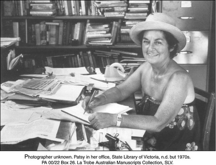Photographer unknown. Patsy [Adam-Smith] in her office, State Library of Victoria, n.d. but 1970s. PA 00/22 Box 26. La Trobe Australian Manuscripts Collection, SLV.