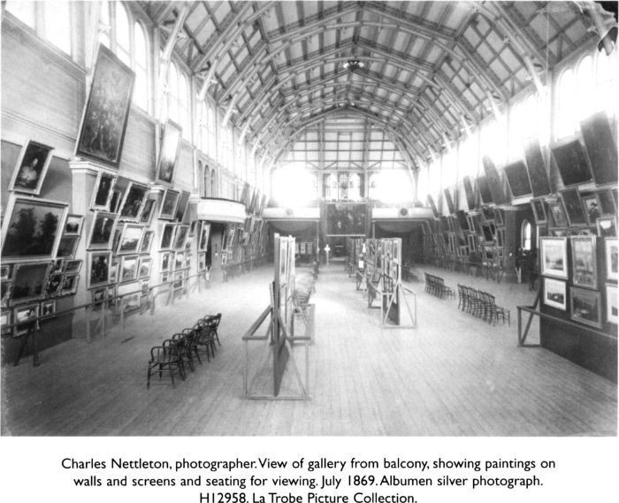 Charles Nettleton, photographer. View of gallery from balcony, showing paintings on walls and screens and seating for viewing. July 1869. Albumen silver photograph. H12958. La Trobe Picture Collection. [photograph]