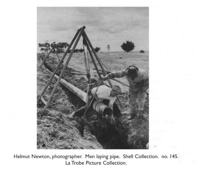 Helmut Newton, photographer. Men laying pipe. Shell Collection. no. 145. La Trobe Picture Collection.