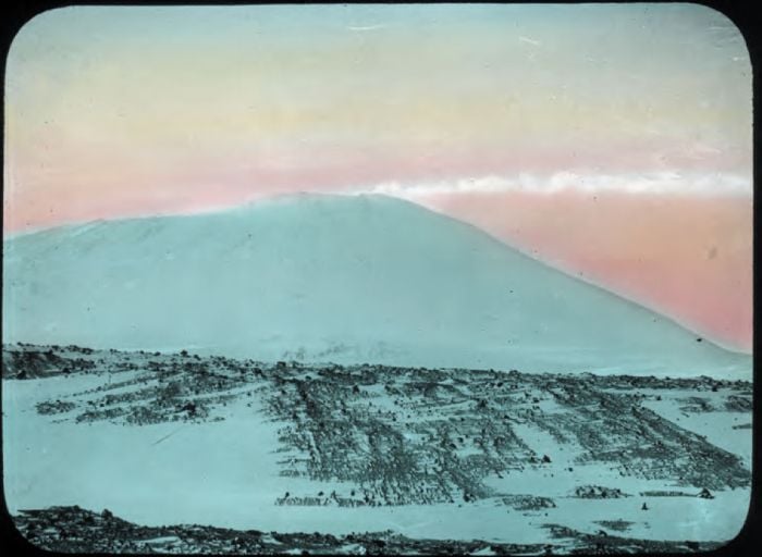 Mt. Erebus Ross Is. Hand-coloured glass lantern slide, ca. 1914-ca. 1917. [Andrew] Keith Jack, compiler. H82.45/42. La Trobe Picture Collection. [hand-coloured photograph]