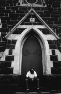 Kim Kruger, Black man [Arthur Cole] and the Church, 1990 Gelatin silver photograph. Pictures Collection, H96.117 [photograph]